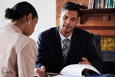Lawyer advising his client on how to deal with a deportation order Lawyer advising his client on how to deal with a deportation order